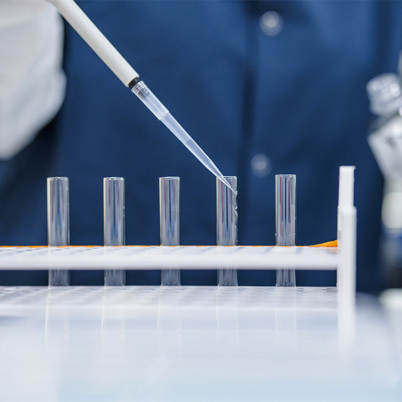 Row of syringes being filled. 