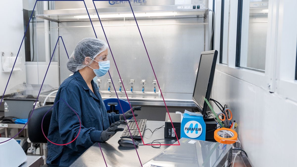 Employee working on lab computer. 